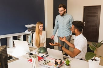 colleagues-talking-in-office