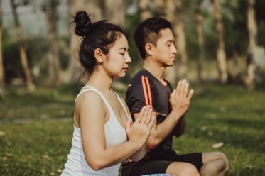 couple-meditating-with-praying-hands_23-2147645858.jpg