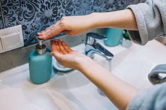 crop-woman-pouring-soap-on-hand_23-2147787912