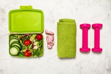 salad-with-dumbbells-and-a-green-towel_1220-852.jpg