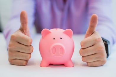 successful-business-man-with-piggy-bank-holding-thumbs-up-in-office_1391-164.jpg