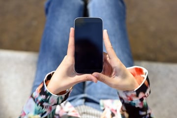 top-view-of-woman-holding-a-mobile-phone_1139-411.jpg