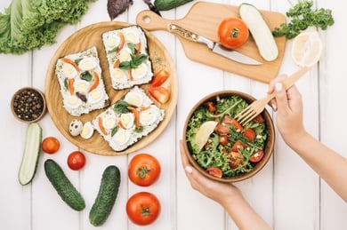 woman-putting-fork-into-salad_23-2147694442.jpg