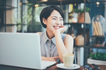 woman-smiling-with-a-coffee-and-a-laptop_1286-231.jpg