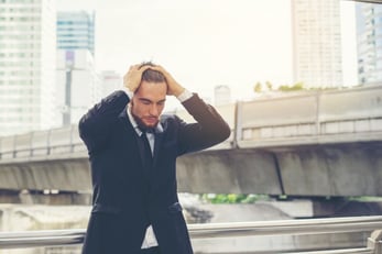 young-businessman-hand-over-on-head-feel-stressed-about-work_1150-2662