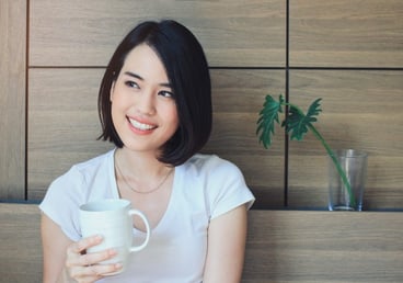 young-happy-woman-in-casual-clothes-relaxing-on-bed-while-drinking-tea-or-coffee-lifestyle-and-wellness-concept_1356-76.jpg